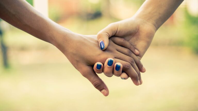 Two people holding hands.