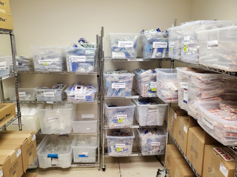 Storage room with large amounts of organized medical supplies.